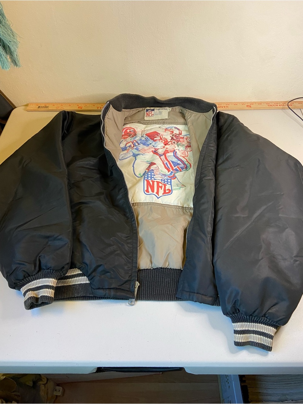 NFL Black Bomber Jacket with Striped Cuffs